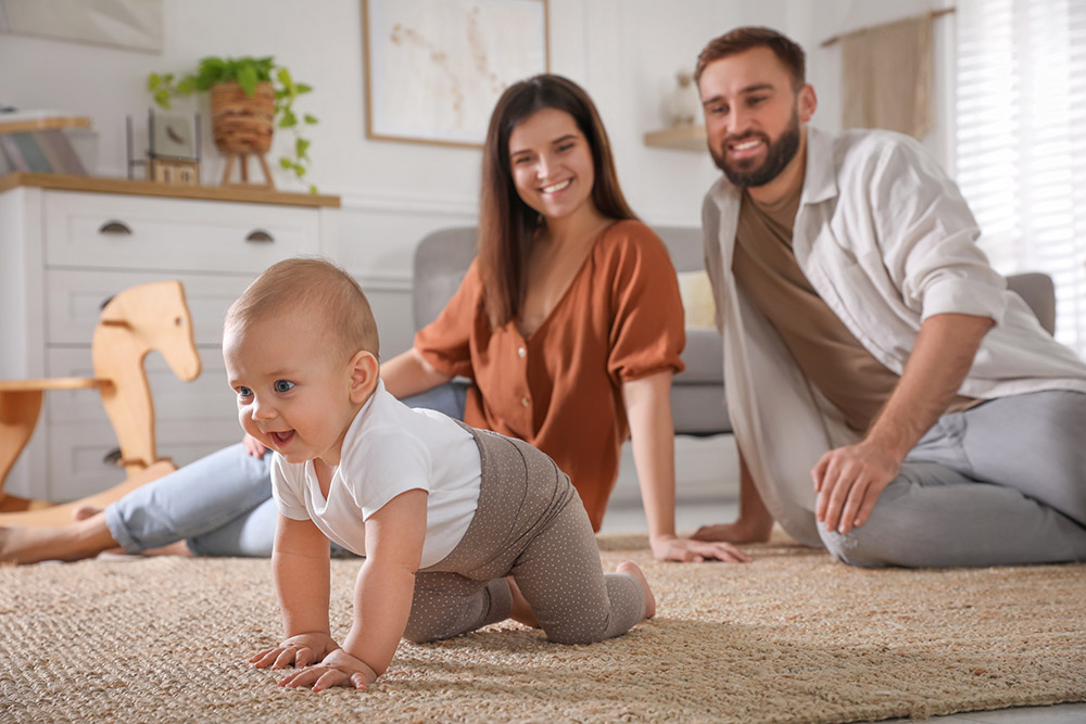 young family on carpet